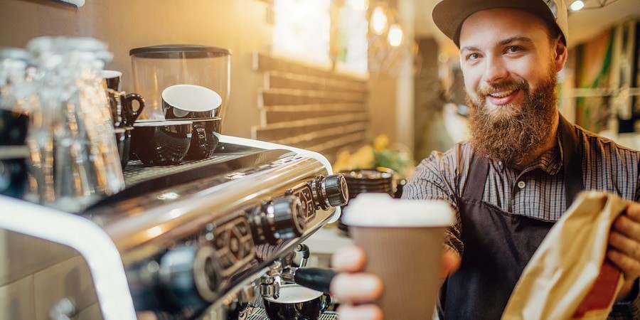 picture young bearded man holding cup coffee bag with food 152404 6755