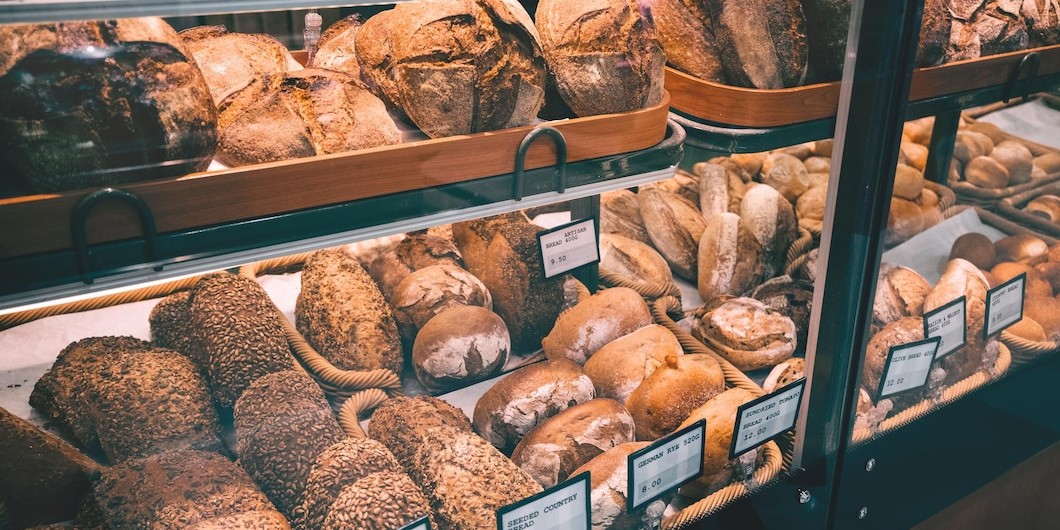 variety whole grain loaves bread grocery store window wi