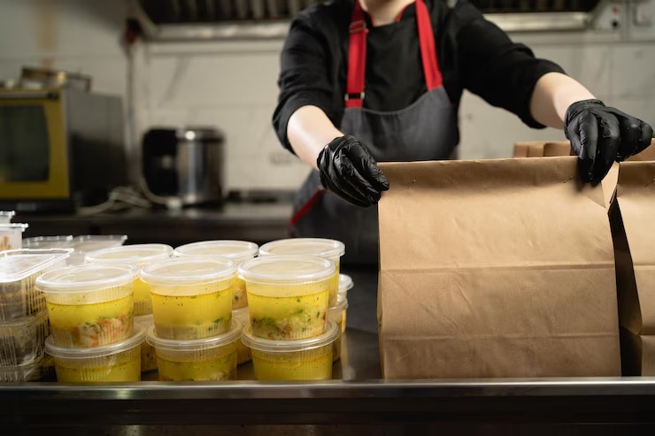 food delivery restaurant closeup hand gloves wrapping disposable