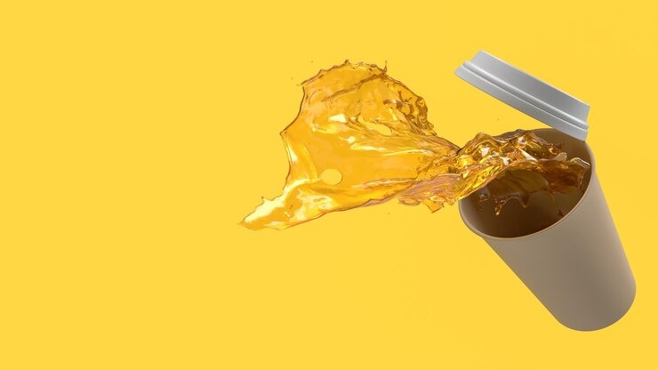 spilled coffee cup yellow background